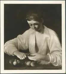 Ragazzo che sbuccia un frutto