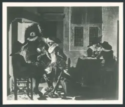 Uomini di fronte a un camino e giocatori di carte