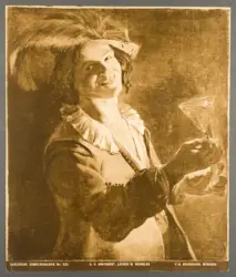 Bevitore che ride con un bicchiere di vino